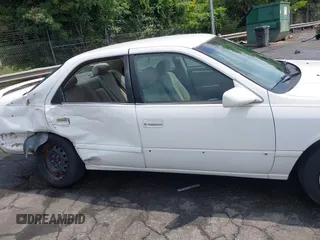 2001 Toyota Camry CE z VIN 4T1BG22KX1U767696, wystawiony jako IAAI lot #42271803 z przebiegiem 130 927 mil mil oraz . Historia ofert i sprzedaży dostępna na DreamBid. Obrazek 13.