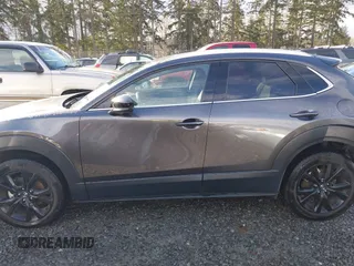 2021 Mazda CX-30 Premium with VIN 3MVDMBDY2MM239231, listed as a IAAI auction lot 41655159 with 22,679 mi miles and . Bid and sale history available at carsss.com. Image 15.