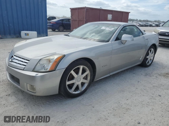 2004 Cadillac XLR z VIN 1G6YV34A945601007, wystawiony jako Copart lot #77077394 z przebiegiem Nie podano mil oraz Szkody całkowita. Historia ofert i sprzedaży dostępna na DreamBid. Obrazek 1.