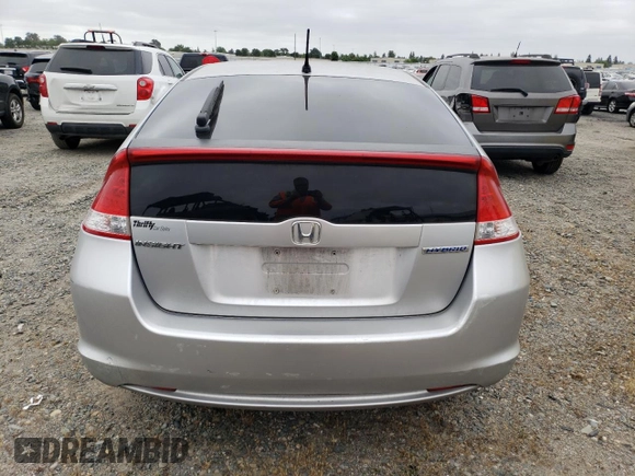 2010 Honda Insight EX with VIN JHMZE2H71AS039108, listed as a Copart auction lot 54557145 with 151,230 mi miles and Salvage title. Bid and sale history available at DreamBid. Image 6.