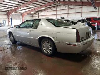 1999 Cadillac Eldorado z VIN 1G6EL12Y1XU611974, wystawiony jako Copart lot #71761494 z przebiegiem 139 494 mil mil oraz Czysty tytuł • Clean title. Historia ofert i sprzedaży dostępna na DreamBid. Obrazek 2.