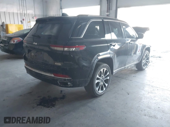 2023 Jeep Grand Cherokee Overland with VIN 1C4RJHDG5PC507978, listed as a IAAI auction lot 41394199 with 57,323 mi miles and . Bid and sale history available at DreamBid. Image 4.