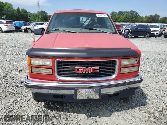 1999 GMC Yukon with VIN 1GKEK13R5XJ700234, listed as a Copart auction lot 55885584 with 163,129 mi miles and Salvage Title. Bid and sale history available at carsss.com. Image 5.