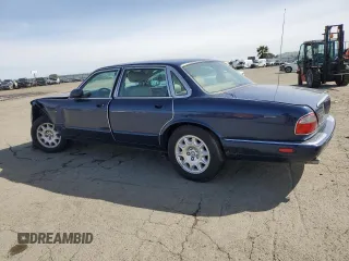 2000 Jaguar XJ with VIN SAJDA14C7YLF18873, listed as a Copart auction lot 50032495 with Not Provided miles and Salvage Title. Bid and sale history available at DreamBid. Image 2.