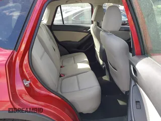 2016 Mazda CX-5 Sport with VIN JM3KE2BY4G0701442, listed as a IAAI auction lot 41682335 with 125,624 mi miles. Bid and sale history available at carsss.com. Image 8.