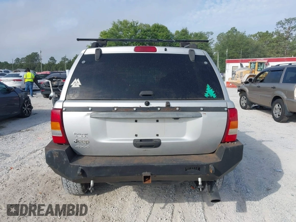 2003 Jeep Grand Cherokee Laredo z VIN 1J8GW48S33C519680, wystawiony jako IAAI lot #42126714 z przebiegiem 295 517 mil mil oraz . Historia ofert i sprzedaży dostępna na DreamBid. Obrazek 16.