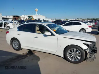 2014 Infiniti Q50 z VIN JN1BV7AP2EM681053, wystawiony jako IAAI lot #41395566 z przebiegiem 230 055 mil mil oraz . Historia ofert i sprzedaży dostępna na DreamBid. Obrazek 14.