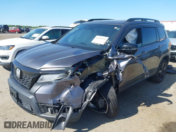 2019 Honda Passport Elite with VIN 5FNYF8H04KB004657, listed as a IAAI auction lot 41993974 with 90,964 mi miles and . Bid and sale history available at DreamBid. Image 2.