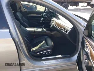 2016 BMW 7 Series 740i with VIN WBA7E2C5XGG739099, listed as a IAAI auction lot 41526038 with 123,900 mi miles. Bid and sale history available at carsss.com. Image 5.