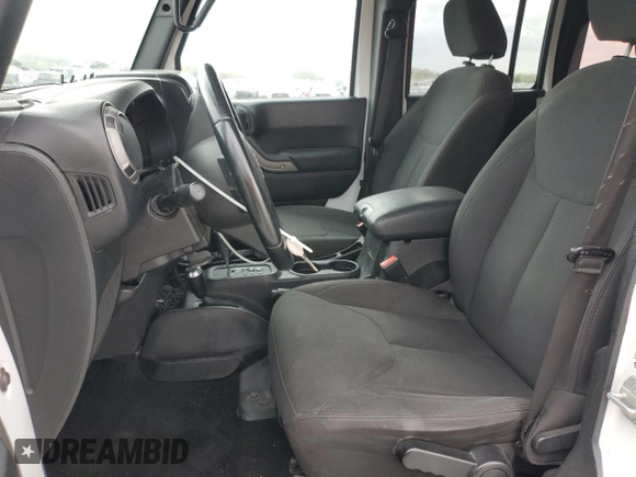 2018 Jeep Wrangler Unlimited Sport with VIN 1C4BJWDG8JL883524, listed as a Copart auction lot 52830295 with 63,659 mi miles and Salvage Title. Bid and sale history available at DreamBid. Image 7.