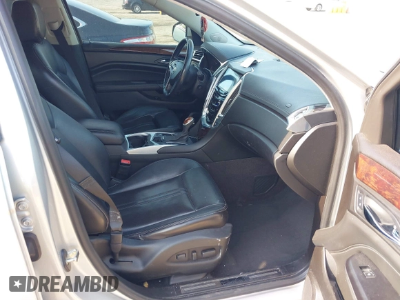 2014 Cadillac SRX Luxury Collection z VIN 3GYFNEE36ES652353, wystawiony jako IAAI lot #42233986 z przebiegiem 146 029 mil mil oraz . Historia ofert i sprzedaży dostępna na DreamBid. Obrazek 5.