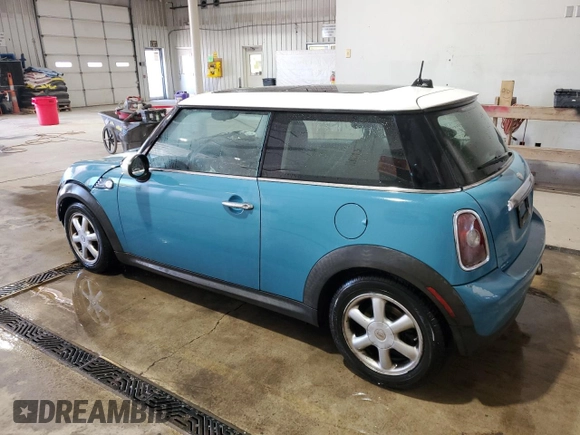 2009 MINI Hardtop with VIN WMWMF33569TW74610, listed as a Copart auction lot 54889805 with 147,533 mi miles and Salvage Title. Bid and sale history available at DreamBid. Image 2.
