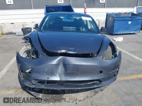 2022 Tesla Model 3 with VIN 5YJ3E1EA1NF142713, listed as a IAAI auction lot 42027630 with 112,557 mi miles. Bid and sale history available at carsss.com. Image 11.