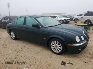 2002 Jaguar S-Type with VIN SAJDA01P12GM27242, listed as a Copart auction lot 88579215 with 218,546 mi miles and Salvage Title. Bid and sale history available at DreamBid. Image 4.
