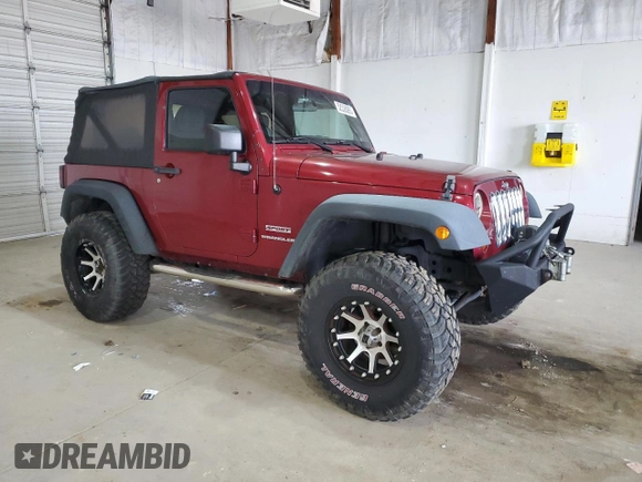 2012 Jeep Wrangler Sport with VIN 1C4AJWAG5CL233049, listed as a Copart auction lot 52328865 with 185,388 mi miles and Salvage title. Bid and sale history available at DreamBid. Image 4.