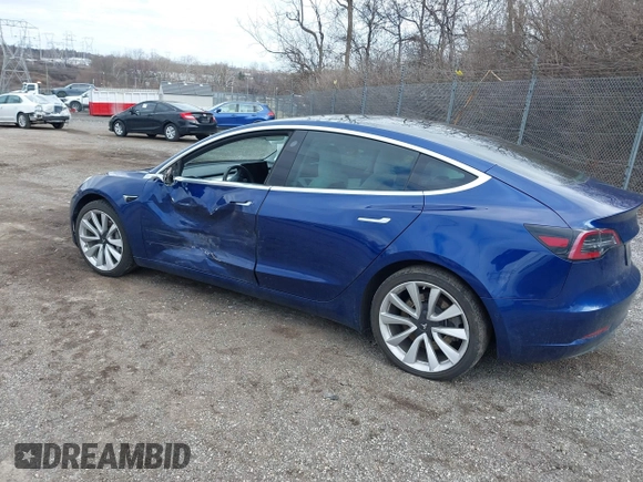 2020 Tesla Model 3 Long Range with VIN 5YJ3E1EB9LF601198, listed as a IAAI auction lot 41744287 with 70,322 mi miles and . Bid and sale history available at DreamBid. Image 3.