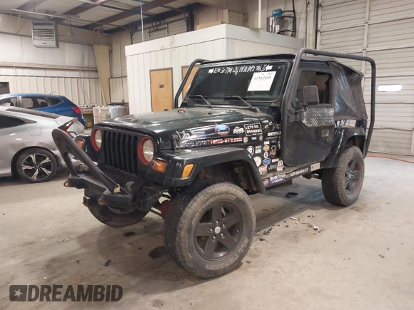 1999 Jeep Wrangler Sahara z VIN 1J4FY49S4XP432567, wystawiony jako IAAI lot #41562455 z przebiegiem Nie podano mil oraz . Historia ofert i sprzedaży dostępna na DreamBid. Obrazek 17.