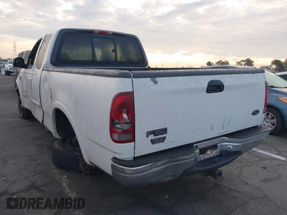 1999 Ford F-150 XL with VIN 1FTRX18L1XKB61205, listed as a IAAI auction lot 40991236 with 178,889 mi miles. Bid and sale history available at carsss.com. Image 3.