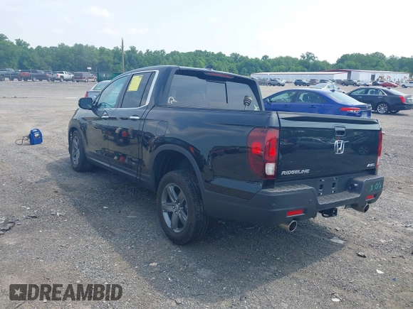 2023 Honda Ridgeline RTL-E with VIN 5FPYK3F71PB022739, listed as a IAAI auction lot 42447428 with 19,702 mi miles and . Bid and sale history available at DreamBid. Image 3.