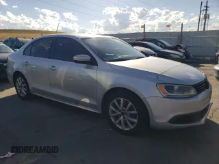 2012 Volkswagen Jetta SE with VIN 3VWDX7AJ4CM077031, listed as a Copart auction lot 67516484 with 201,024 mi miles and Salvage title. Bid and sale history available at DreamBid. Image 4.