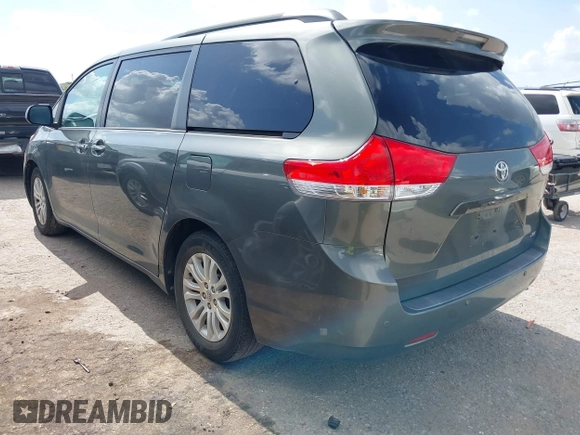 2014 Toyota Sienna XLE with VIN 5TDYK3DC2ES448876, listed as a IAAI auction lot 42519351 with 154,601 mi miles and . Bid and sale history available at DreamBid. Image 3.