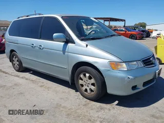 2002 Honda Odyssey EX z VIN 2HKRL18662H588523, wystawiony jako IAAI lot #42236133 z przebiegiem 300 409 mil mil oraz . Historia ofert i sprzedaży dostępna na DreamBid. Obrazek 1.