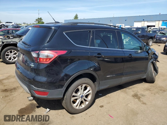 2017 Ford Escape SE z VIN 1FMCU0GD5HUD52467, wystawiony jako Copart lot #70616944 z przebiegiem 115 876 mil mil oraz Szkoda całkowita • Salvage title. Historia ofert i sprzedaży dostępna na DreamBid. Obrazek 3.