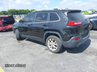 2015 Jeep Cherokee Latitude with VIN 1C4PJLCB4FW683904, listed as a IAAI auction lot 41579059 with 126,156 mi miles and . Bid and sale history available at carsss.com. Image 3.