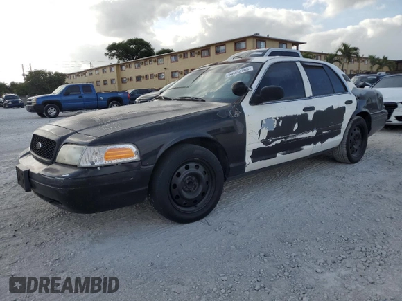 2005 Ford Police Interceptor with VIN 2FAFP71W35X128684, listed as a Copart auction lot 54002165 with 144,766 mi miles and Clean title. Bid and sale history available at DreamBid. Image 1.