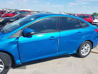 2015 Ford Focus SE with VIN 1FADP3F21FL379837, listed as a IAAI auction lot 42021623 with 146,571 mi miles. Bid and sale history available at carsss.com. Image 6.