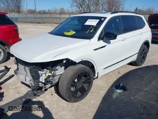 2024 Volkswagen Tiguan SE R-Line Black with VIN 3VV8B7AX3RM052588, listed as a IAAI auction lot 41876448 with 22,835 mi miles and . Bid and sale history available at DreamBid. Image 2.