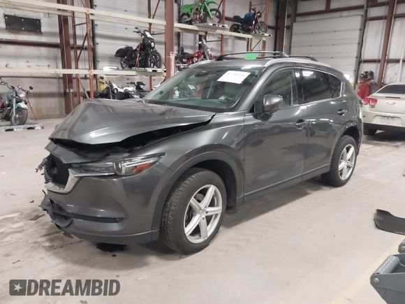 2020 Mazda CX-5 Grand Touring with VIN JM3KFBDM3L0739763, listed as a IAAI auction lot 41751250 with 88,063 mi miles and . Bid and sale history available at carsss.com. Image 2.