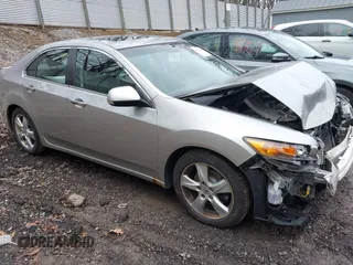 2010 Acura TSX with VIN JH4CU2F64AC031288, listed as a IAAI auction lot 42023406 with 144,192 mi miles. Bid and sale history available at carsss.com. Image 1.