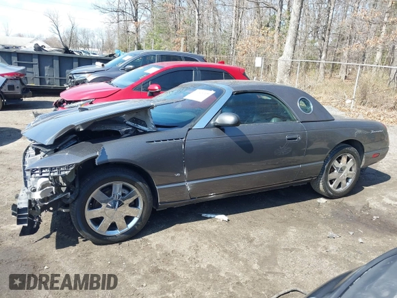 2003 Ford Thunderbird Deluxe z VIN 1FAHP60A23Y101899, wystawiony jako IAAI lot #41805269 z przebiegiem Nie podano mil oraz . Historia ofert i sprzedaży dostępna na DreamBid. Obrazek 14.
