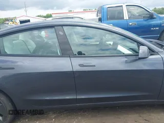 2023 Tesla Model 3 with VIN 5YJ3E1EAXPF628911, listed as a IAAI auction lot 42362410 with 25,387 mi miles and . Bid and sale history available at DreamBid. Image 14.