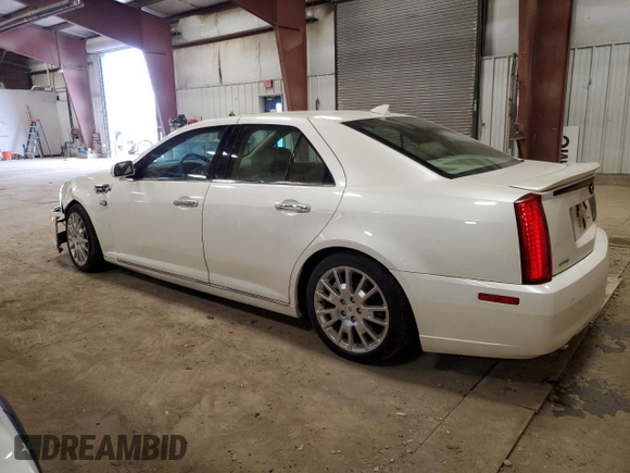 2010 Cadillac STS AWD z VIN 1G6DU6EV0A0106434, wystawiony jako Copart lot #52439915 z przebiegiem 90 187 mil mil oraz Czysty tytuł • Clean title. Historia ofert i sprzedaży dostępna na DreamBid. Obrazek 2.