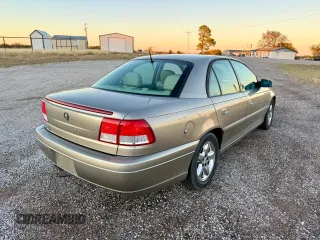 2001 Cadillac Catera z VIN W06VR54R01R009345, wystawiony jako Copart lot #80393534 z przebiegiem 43 757 mil mil oraz Tytuł czysty. Historia ofert i sprzedaży dostępna na DreamBid. Obrazek 4.