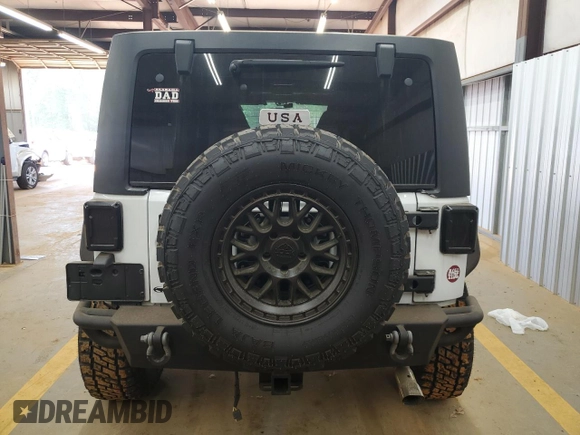 2012 Jeep Wrangler Unlimited Sport z VIN 1C4BJWDG4CL140250, wystawiony jako Copart lot #55174665 z przebiegiem 91 285 mil mil oraz Szkoda całkowita • Salvage title. Historia ofert i sprzedaży dostępna na DreamBid. Obrazek 6.