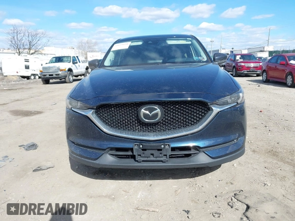 2020 Mazda CX-5 Grand Touring with VIN JM3KFBDM2L0768770, listed as a IAAI auction lot 41695058 with 44,192 mi miles. Bid and sale history available at carsss.com. Image 11.