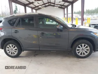 2016 Mazda CX-5 Touring with VIN JM3KE4CY4G0779827, listed as a IAAI auction lot 41840727 with 91,367 mi miles. Bid and sale history available at carsss.com. Image 14.