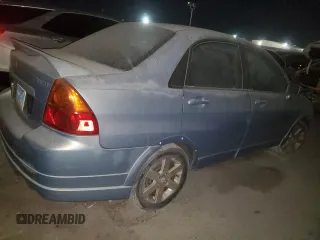 2005 Suzuki Aerio S z VIN JS2RA61SX55250286, wystawiony jako Copart lot #73859164 z przebiegiem 120 033 mil mil oraz Nie do naprawy. Historia ofert i sprzedaży dostępna na DreamBid. Obrazek 3.