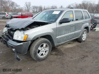 2007 Jeep Grand Cherokee Laredo with VIN 1J8GR48K57C556517, listed as a IAAI auction lot 41534166 with 158,914 mi miles. Bid and sale history available at carsss.com. Image 2.