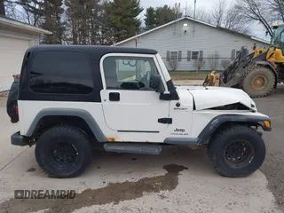 2005 Jeep Wrangler Sport with VIN 1J4FA49S25P352170, listed as a IAAI auction lot 41794958 with 154,304 mi miles. Bid and sale history available at carsss.com. Image 14.
