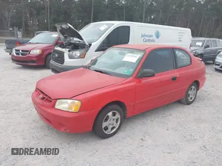 2002 Hyundai Accent GL with VIN KMHCG35C32U157056, listed as a IAAI auction lot 41538381 with 127,518 mi miles. Bid and sale history available at carsss.com. Image 2.