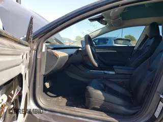 2023 Tesla Model 3 with VIN 5YJ3E1EA2PF640289, listed as a IAAI auction lot 42000200 with 14,194 mi miles and . Bid and sale history available at DreamBid. Image 5.