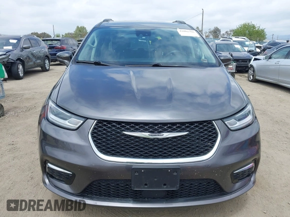 2022 Chrysler Pacifica Touring L z VIN 2C4RC1BG0NR134194, wystawiony jako IAAI lot #42082795 z przebiegiem 98 845 mil mil oraz . Historia ofert i sprzedaży dostępna na DreamBid. Obrazek 13.