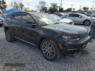 2023 Jeep Grand Cherokee Summit Reserve with VIN 1C4RJKEG5P8853916, listed as a Copart auction lot 52691735 with 18,899 mi miles and Salvage title. Bid and sale history available at DreamBid. Image 4.