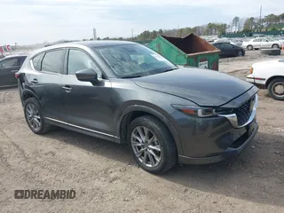 2024 Mazda CX-5 S Premium z VIN JM3KFBDLXR0486618, wystawiony jako IAAI lot #42055952 z przebiegiem 4559 mil mil oraz . Historia ofert i sprzedaży dostępna na DreamBid. Obrazek 1.