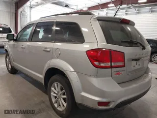 2013 Dodge Journey SXT with VIN 3C4PDCBG4DT720912, listed as a IAAI auction lot 39184206 with 120,147 mi miles. Bid and sale history available at carsss.com. Image 3.
