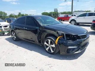 2019 Kia Optima LX z VIN 5XXGT4L39KG356953, wystawiony jako IAAI lot #41890949 z przebiegiem 122 423 mil mil oraz . Historia ofert i sprzedaży dostępna na DreamBid. Obrazek 1.
